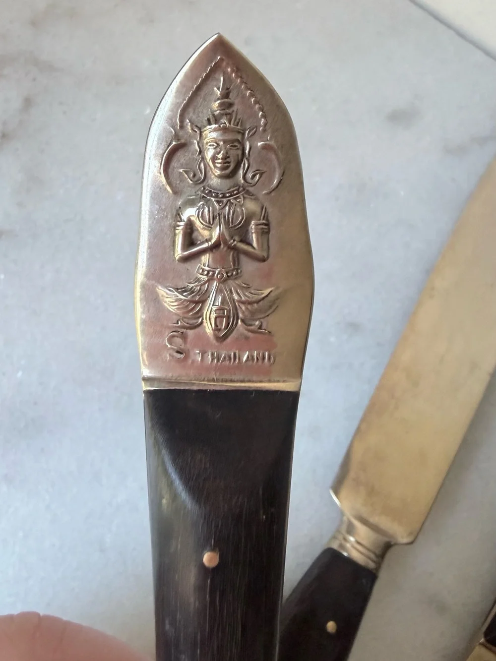 set consists of vintage Thai brass or bronze utensils with dark wooden handles.